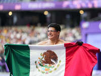 Juan Pablo Cervantes Garcia of Mexico celebrates winning gold in Men's 100m - T54 Final during the Paris 2024 Paralympic Games at Stade de F...