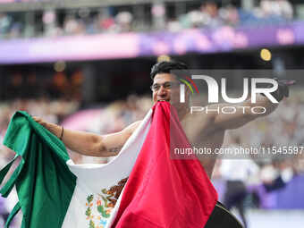 Juan Pablo Cervantes Garcia of Mexico celebrates winning gold in Men's 100m - T54 Final during the Paris 2024 Paralympic Games at Stade de F...