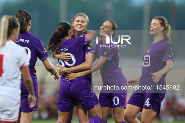 Luna Vanzeir (center back) of Anderlecht celebrates scoring the 4-0 goal with teammate Stefania Vatafu (front 3rd left) during the UEFA Wome...