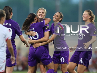 Luna Vanzeir (center back) of Anderlecht celebrates scoring the 4-0 goal with teammate Stefania Vatafu (front 3rd left) during the UEFA Wome...