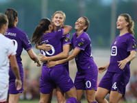 Luna Vanzeir (center back) of Anderlecht celebrates scoring the 4-0 goal with teammate Stefania Vatafu (front 3rd left) during the UEFA Wome...