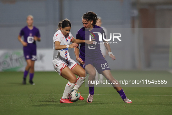 Nina Cavic (L) of Crvena Zvezda vies for the ball with Amelie Delabre (R) of Anderlecht during the UEFA Women's Champions League First quali...