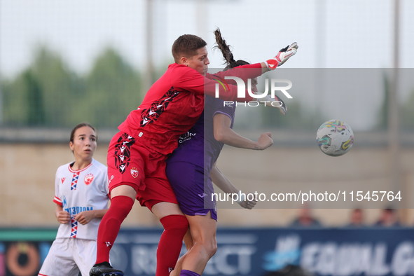 Roksana Shahanska, goalkeeper of Crvena Zvezda, punches the ball ahead of Amelie Delabre of Anderlecht during the UEFA Women's Champions Lea...