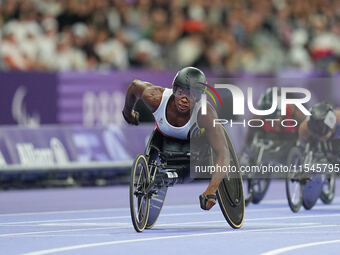 Lea Bayekula of Belgium celebrates winning gold in Women's 100m - T54 Final during the Paris 2024 Paralympic Games at Stade de France on Sep...