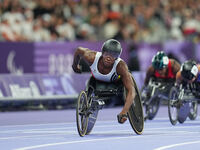 Lea Bayekula of Belgium celebrates winning gold in Women's 100m - T54 Final during the Paris 2024 Paralympic Games at Stade de France on Sep...