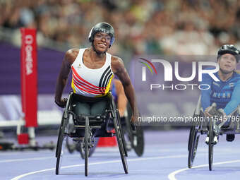 Lea Bayekula of Belgium celebrates winning gold in Women's 100m - T54 Final during the Paris 2024 Paralympic Games at Stade de France on Sep...