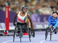 Lea Bayekula of Belgium celebrates winning gold in Women's 100m - T54 Final during the Paris 2024 Paralympic Games at Stade de France on Sep...