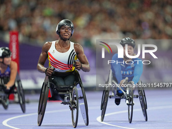 Lea Bayekula of Belgium celebrates winning gold in Women's 100m - T54 Final during the Paris 2024 Paralympic Games at Stade de France on Sep...