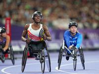 Lea Bayekula of Belgium celebrates winning gold in Women's 100m - T54 Final during the Paris 2024 Paralympic Games at Stade de France on Sep...