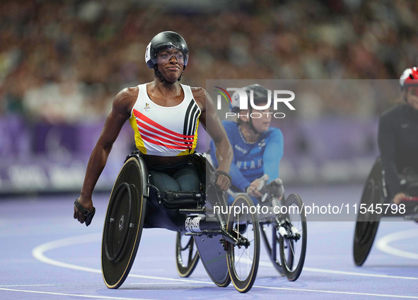 Lea Bayekula of Belgium celebrates winning gold in Women's 100m - T54 Final during the Paris 2024 Paralympic Games at Stade de France on Sep...