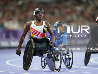 Lea Bayekula of Belgium celebrates winning gold in Women's 100m - T54 Final during the Paris 2024 Paralympic Games at Stade de France on Sep...