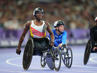 Lea Bayekula of Belgium celebrates winning gold in Women's 100m - T54 Final during the Paris 2024 Paralympic Games at Stade de France on Sep...