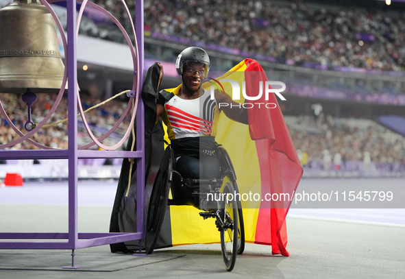 Lea Bayekula of Belgium celebrates winning gold in Women's 100m - T54 Final during the Paris 2024 Paralympic Games at Stade de France on Sep...