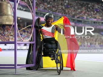 Lea Bayekula of Belgium celebrates winning gold in Women's 100m - T54 Final during the Paris 2024 Paralympic Games at Stade de France on Sep...