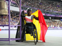 Lea Bayekula of Belgium celebrates winning gold in Women's 100m - T54 Final during the Paris 2024 Paralympic Games at Stade de France on Sep...