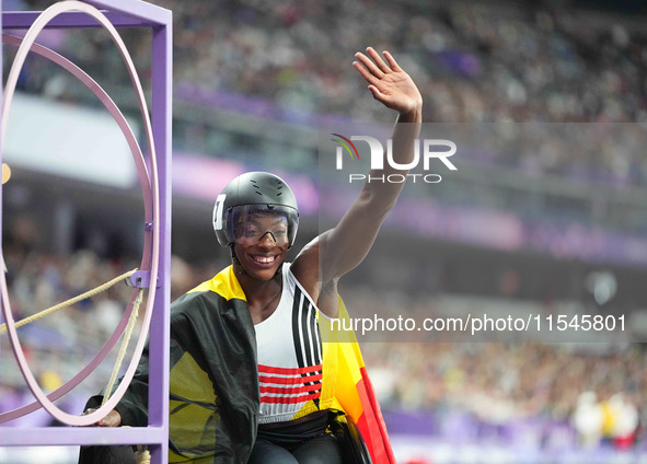 Lea Bayekula of Belgium celebrates winning gold in Women's 100m - T54 Final during the Paris 2024 Paralympic Games at Stade de France on Sep...