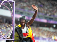 Lea Bayekula of Belgium celebrates winning gold in Women's 100m - T54 Final during the Paris 2024 Paralympic Games at Stade de France on Sep...