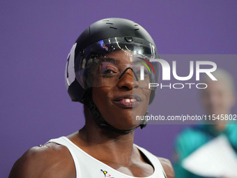 Lea Bayekula of Belgium celebrates winning gold in Women's 100m - T54 Final during the Paris 2024 Paralympic Games at Stade de France on Sep...