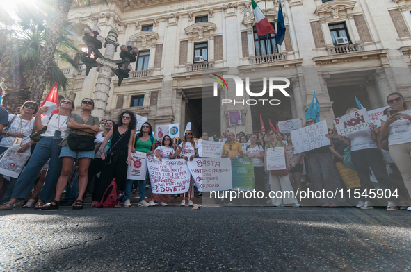 Temporary teachers, support teachers, and parents of disabled children demonstrate in front of the Ministry of Education and Merit against p...