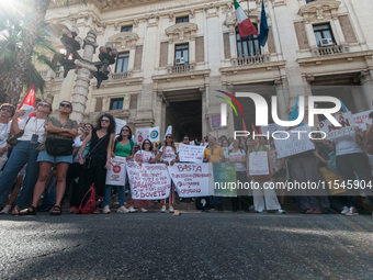 Temporary teachers, support teachers, and parents of disabled children demonstrate in front of the Ministry of Education and Merit against p...