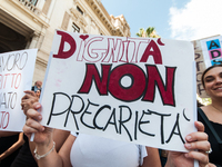 Temporary teachers, support teachers, and parents of disabled children demonstrate in front of the Ministry of Education and Merit against p...