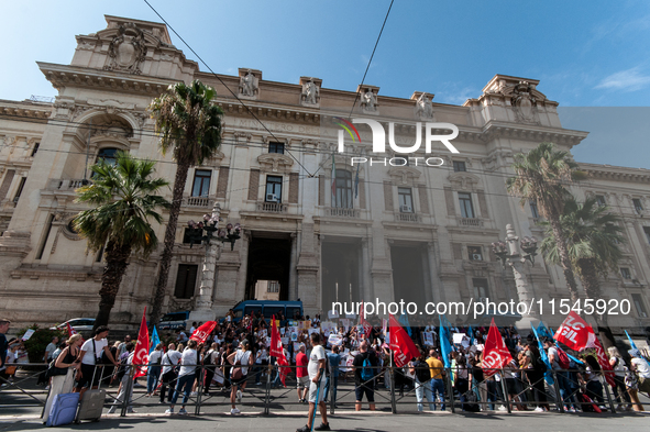 Temporary teachers, support teachers, and parents of disabled children demonstrate in front of the Ministry of Education and Merit against p...