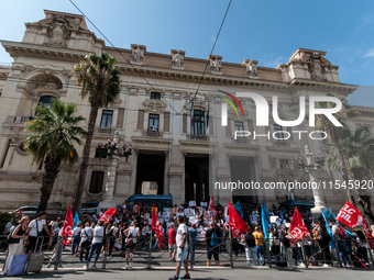 Temporary teachers, support teachers, and parents of disabled children demonstrate in front of the Ministry of Education and Merit against p...