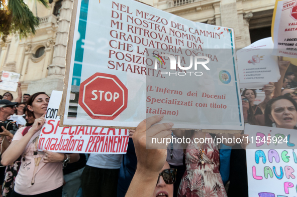 Temporary teachers, support teachers, and parents of disabled children demonstrate in front of the Ministry of Education and Merit against p...