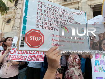 Temporary teachers, support teachers, and parents of disabled children demonstrate in front of the Ministry of Education and Merit against p...