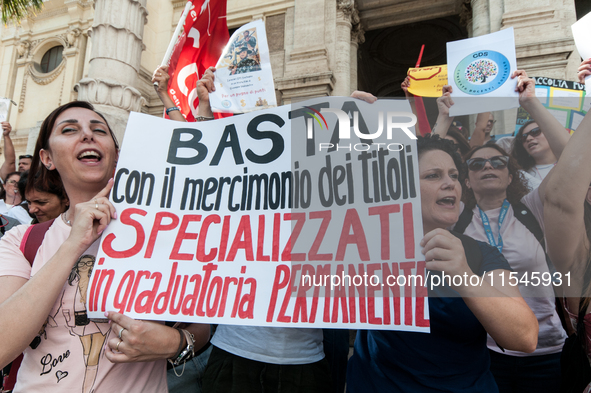 Temporary teachers, support teachers, and parents of disabled children demonstrate in front of the Ministry of Education and Merit against p...