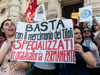 Temporary teachers, support teachers, and parents of disabled children demonstrate in front of the Ministry of Education and Merit against p...