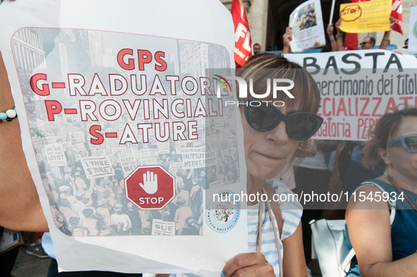 Temporary teachers, support teachers, and parents of disabled children demonstrate in front of the Ministry of Education and Merit against p...