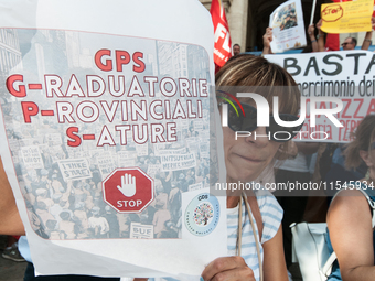 Temporary teachers, support teachers, and parents of disabled children demonstrate in front of the Ministry of Education and Merit against p...