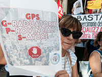 Temporary teachers, support teachers, and parents of disabled children demonstrate in front of the Ministry of Education and Merit against p...