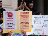 Temporary teachers, support teachers, and parents of disabled children demonstrate in front of the Ministry of Education and Merit against p...