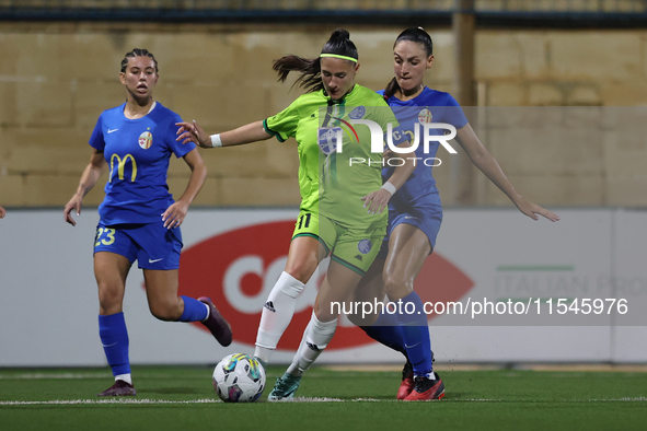 Tatjana Osmajic of Breznica is closely followed by Gabriella Zahra of Birkirkara during the UEFA Women's Champions League First qualifying r...