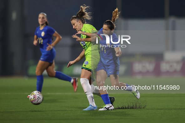 Marijana Jankov of Breznica is closely followed by Yuna Hazekawa of Birkirkara during the UEFA Women's Champions League First qualifying rou...