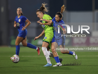 Marijana Jankov of Breznica is closely followed by Yuna Hazekawa of Birkirkara during the UEFA Women's Champions League First qualifying rou...