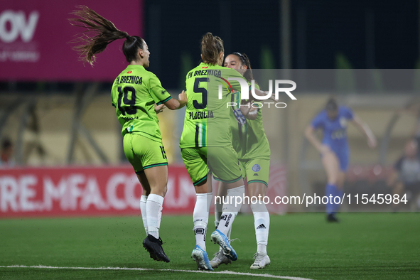 Marijana Jankov (center) of Breznica reacts after scoring the 1-0 goal with teammates during the UEFA Women's Champions League First qualify...