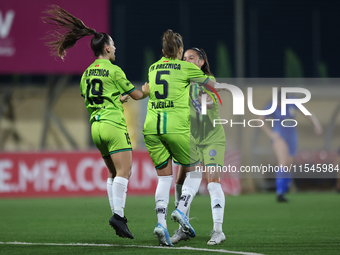 Marijana Jankov (center) of Breznica reacts after scoring the 1-0 goal with teammates during the UEFA Women's Champions League First qualify...