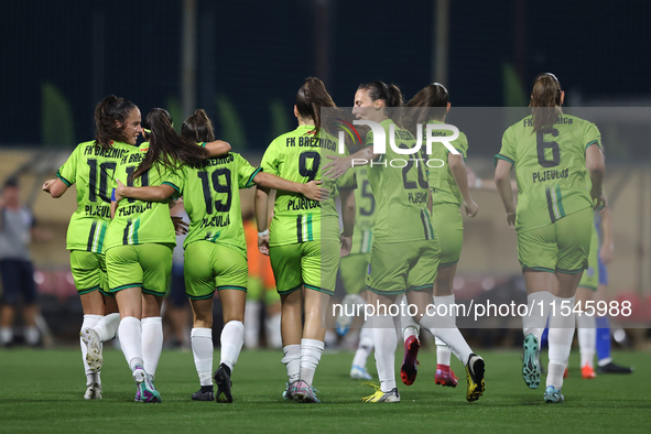 Soccer players from Breznica celebrate Marijana Jankov (center back partially hidden) scoring the 1-0 goal during the UEFA Women's Champions...