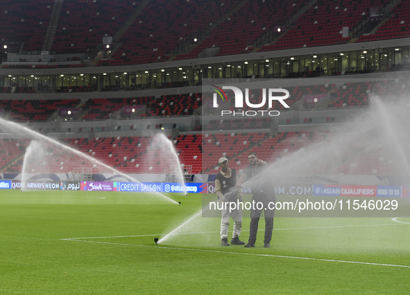 Sprinklers water the pitch inside Ahmad Bin Ali Stadium before the training session ahead of the FIFA World Cup 2026 AFC Asian qualifier 3rd...