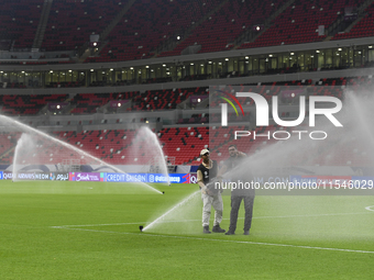 Sprinklers water the pitch inside Ahmad Bin Ali Stadium before the training session ahead of the FIFA World Cup 2026 AFC Asian qualifier 3rd...