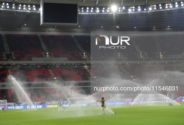 Sprinklers water the pitch inside Ahmad Bin Ali Stadium before the training session ahead of the FIFA World Cup 2026 AFC Asian qualifier 3rd...