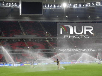 Sprinklers water the pitch inside Ahmad Bin Ali Stadium before the training session ahead of the FIFA World Cup 2026 AFC Asian qualifier 3rd...