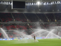 Sprinklers water the pitch inside Ahmad Bin Ali Stadium before the training session ahead of the FIFA World Cup 2026 AFC Asian qualifier 3rd...