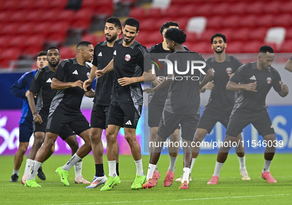 Players of the Qatar National team train at Ahmad Bin Ali Stadium in Al Rayyan, Qatar, on September 4, 2024, on the eve of their Qualificati...