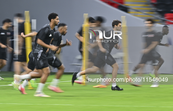 Players of the Qatar National team train at Ahmad Bin Ali Stadium in Al Rayyan, Qatar, on September 4, 2024, on the eve of their Qualificati...