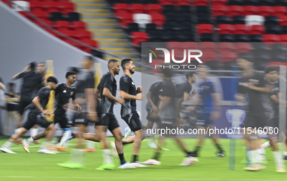 Players of the Qatar National team train at Ahmad Bin Ali Stadium in Al Rayyan, Qatar, on September 4, 2024, on the eve of their Qualificati...