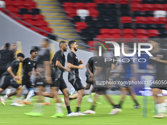 Players of the Qatar National team train at Ahmad Bin Ali Stadium in Al Rayyan, Qatar, on September 4, 2024, on the eve of their Qualificati...